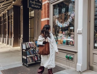 person window shopping at book store