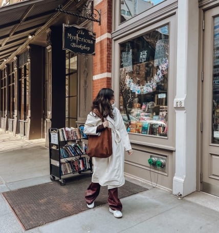 person window shopping at book store