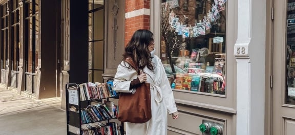 person window shopping at book store