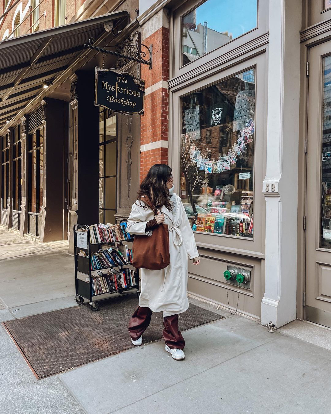 person window shopping at book store