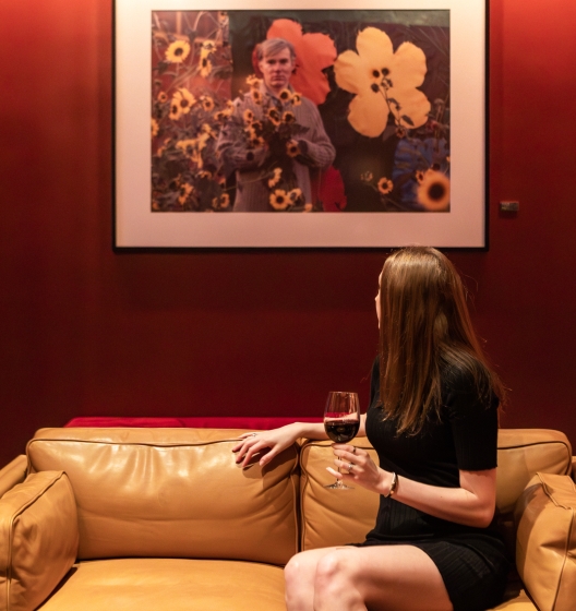 Woman admires artwork at Smyth Tribeca hotel NYC
