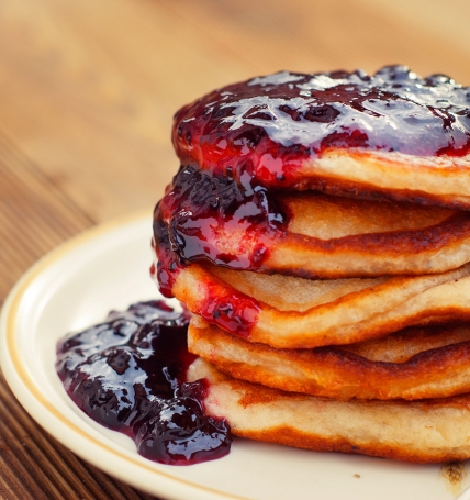 Homemade Breakfast, pancakeswith fruit jam, on wooden table. Pastry food. Dessert for kids.