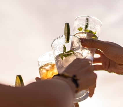 cheers with cocktails outside