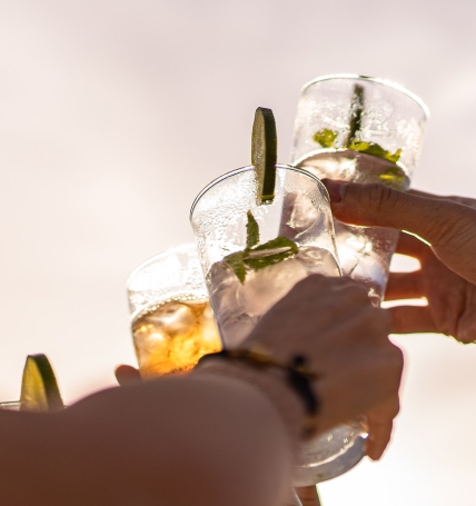 cheers with cocktails outside