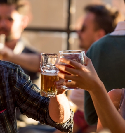 Happy couple having drinks at a bar