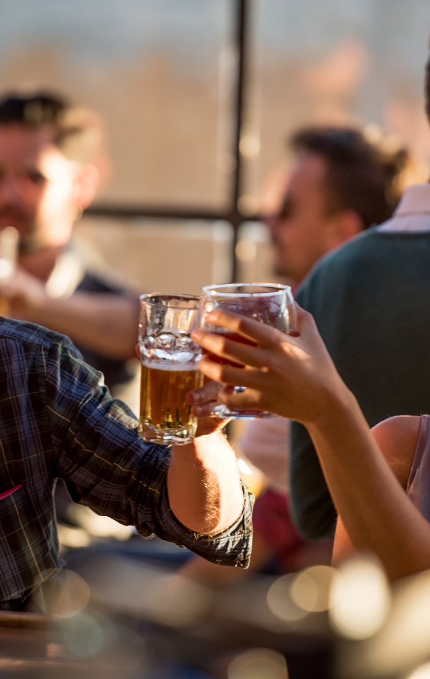 Happy couple having drinks at a bar