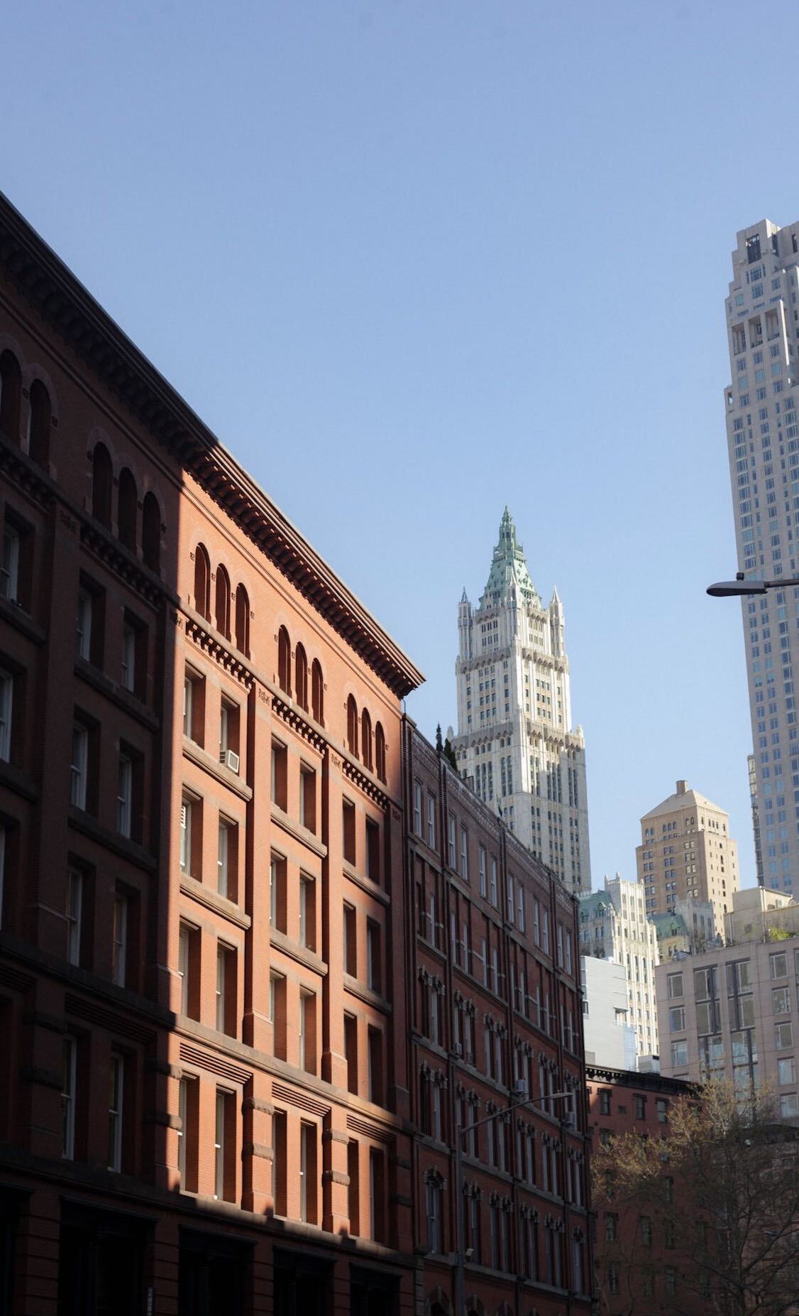 Red building facade in lower Manhattan skyline