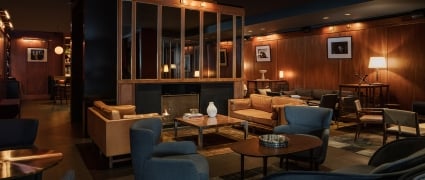 Smyth's Galerie Bar lounge with blue chairs