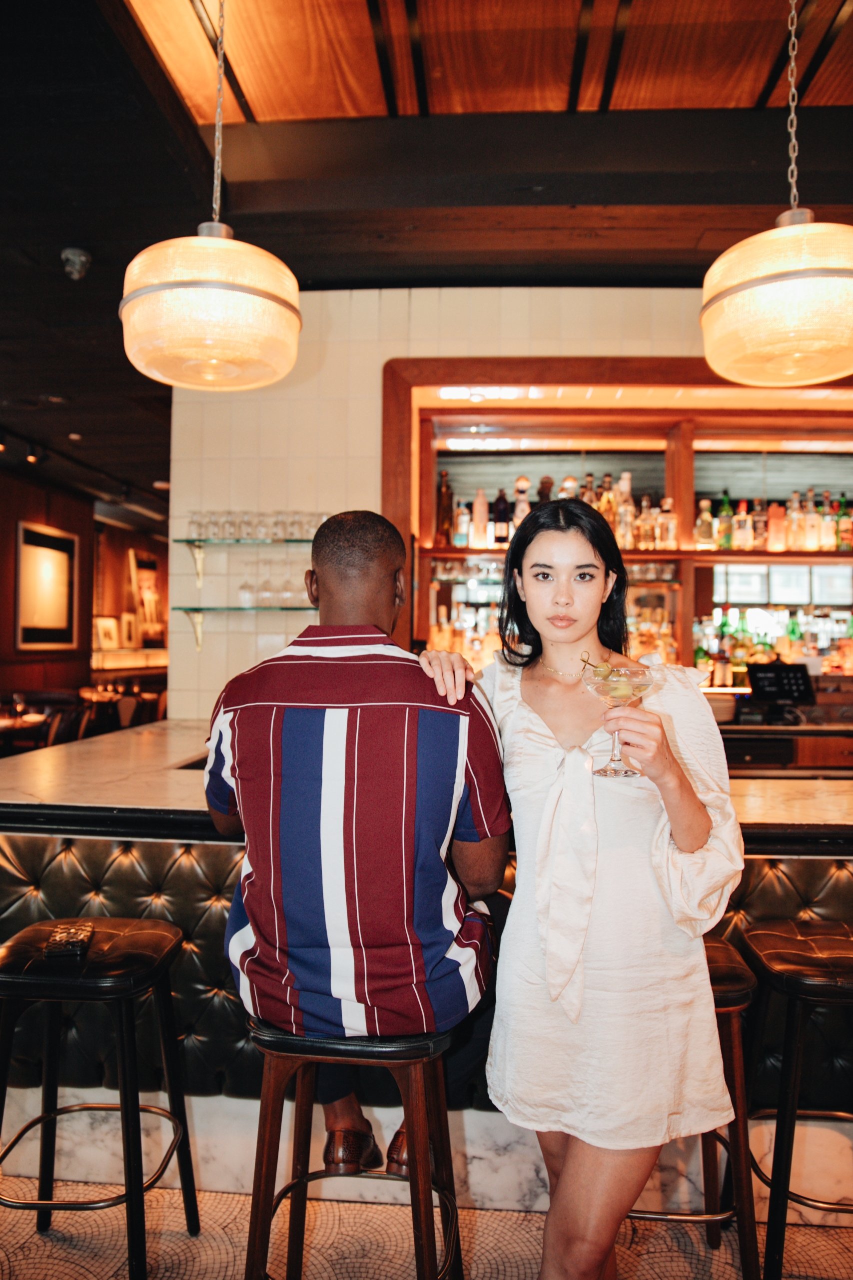 Woman and man sitting at Smyth's Tribeca bar in New York; New York Tribeca bar