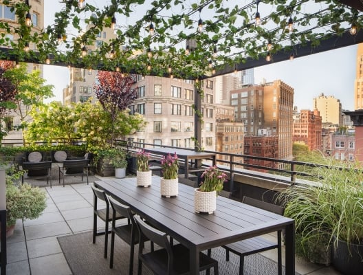 outdoor dining table on rooftop terrace suite