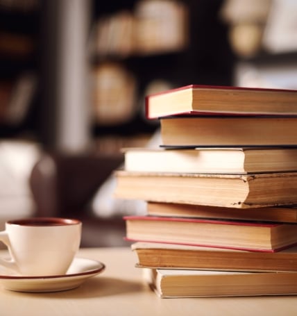 stack of books and coffee