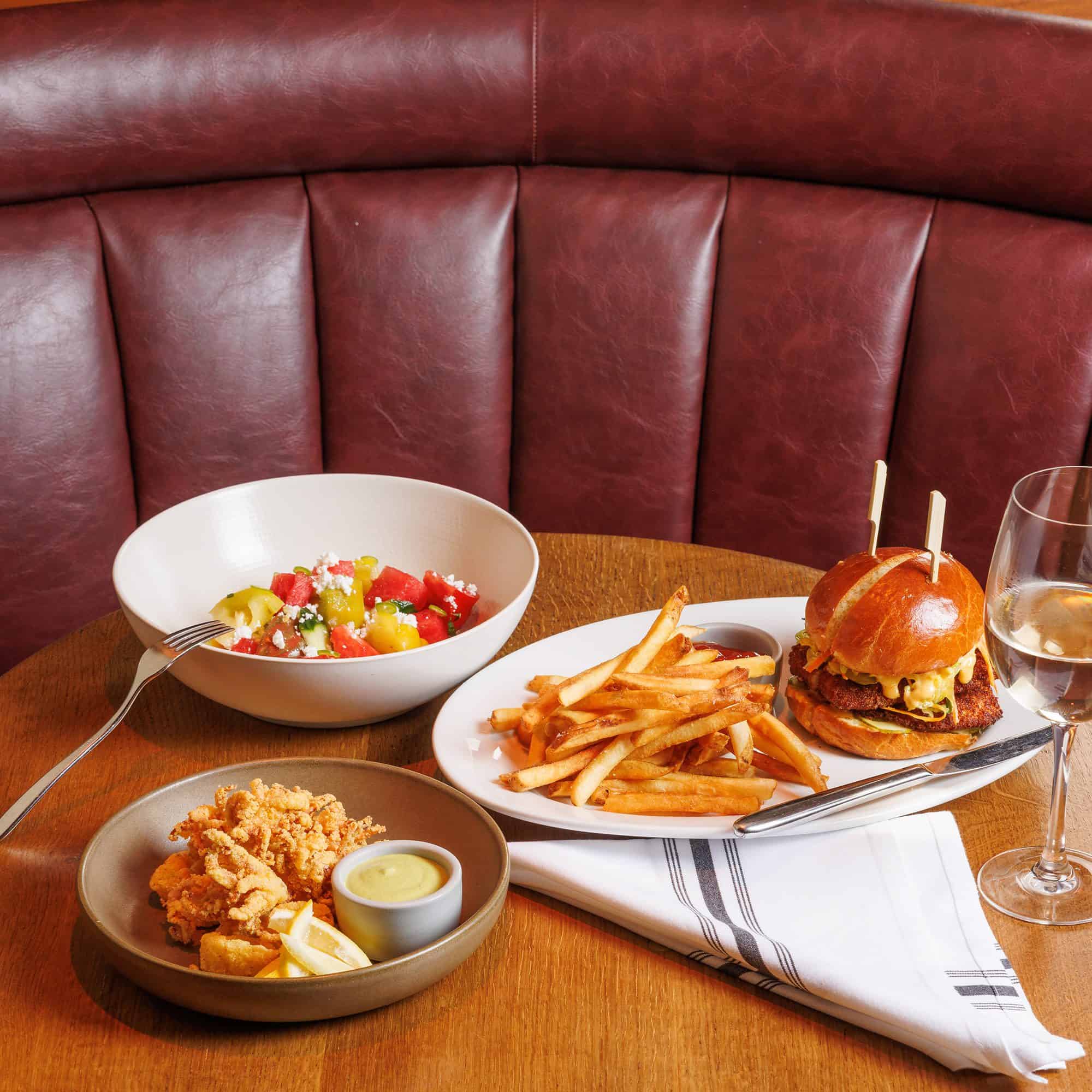 a dining table set with food and drink