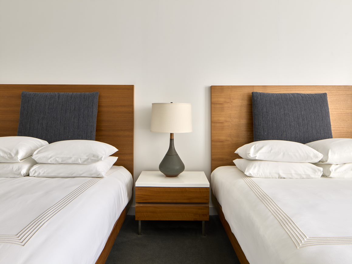 hotel room in New York with two double beds