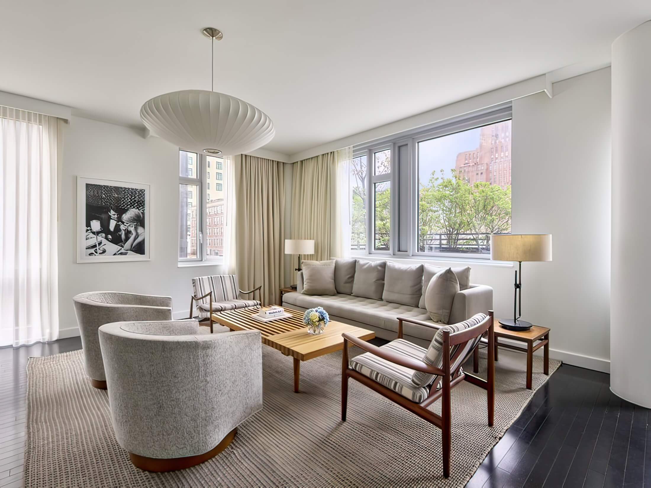 Smyth's Tribeca hotel room living room with view of Tribeca NY