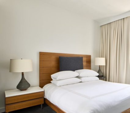 Hotel room in New York with queen bed and private terrace